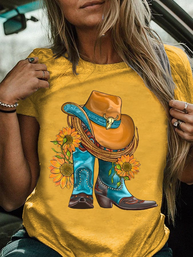 Western hat and cowboy boots paired with a sunflower print T-shirt