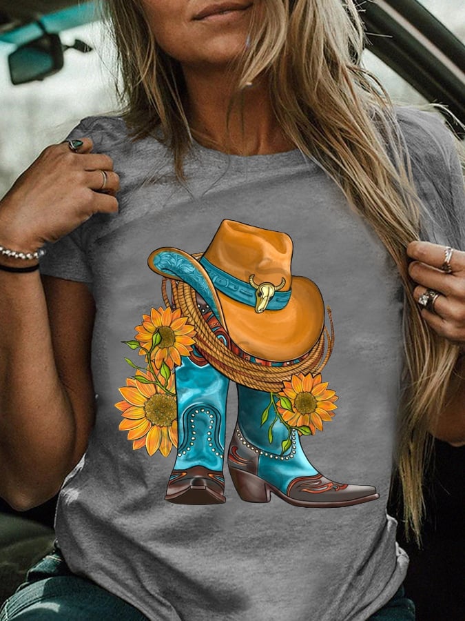 Western hat and cowboy boots paired with a sunflower print T-shirt