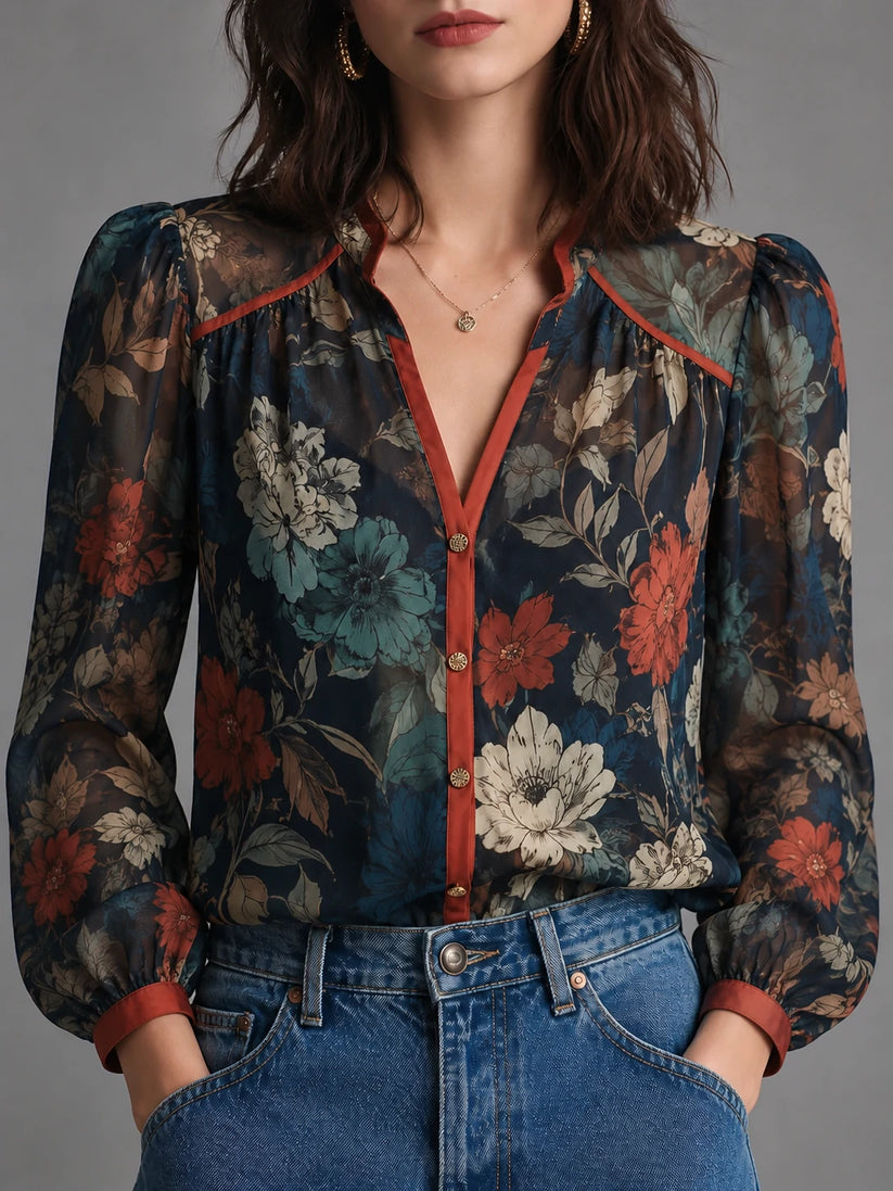 Navy floral blouse with rust-red trim, front view